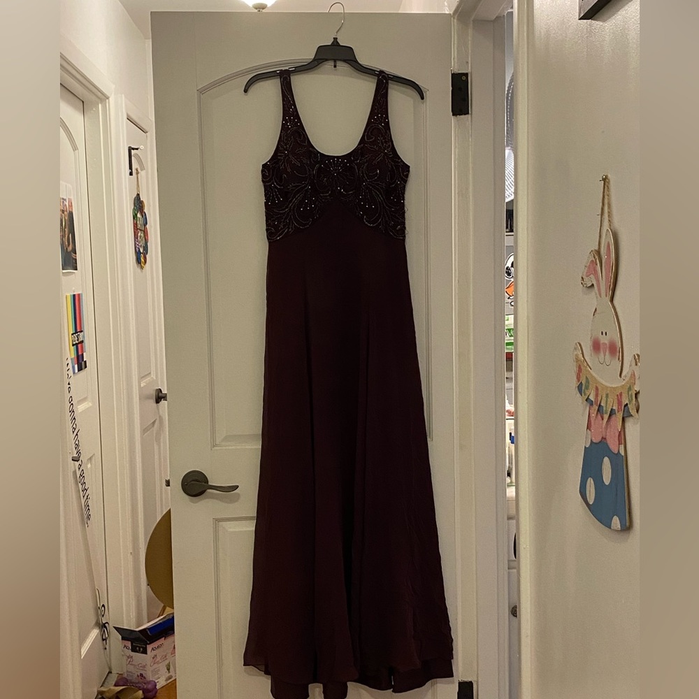 Purple dress with beads.